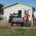 Renate and Markus in front of my house and buggy, Outapi